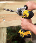 Person using Ship Auger Drill Bit For Hardwood And Nail Embedded Wood, 1 Inch By 17 Inch, Self Feed Spur Tip, Hardened Alloy Steel