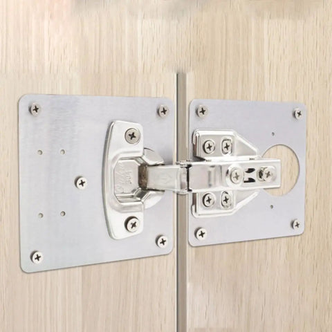 Close-up of stainless steel cabinet hinge repair plates with screws, 6 pack frameless cabinet fixes for kitchen cabinets.