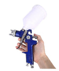 Heavy Duty Handheld Airbrush Kit With Three Precision Nozzles For A Smooth As Butter Spray Gun Finish Featuring Easy Setup And Durable All Copper Flow Cap Perfect For Stress Free Diy Painting On Furniture Cars And Bikes, close-up of blue airbrush spray gun held in hand