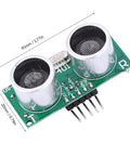 Top-Notch Ultrasonic Sensor Module with Temperature Compensation, green PCB with two circular transducers, top view.