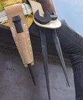 Workhorse Construction Spud Wrench With Tether Hole Made In USA 1-1/4 Inch Opening hanging from tool belt on worker's hip.