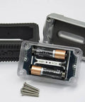 Disassembled parts of Inline 1 Inch Digital Turbine Meter for Chemical Transfers, batteries, nickel plated housing, and screws