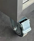 Built Like Beef Rolling Steel Tool Cabinet With Grip Tight Locking Drawers mobile workbench caster wheel close-up on a garage floor.