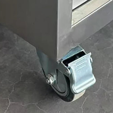 Built Like Beef Rolling Steel Tool Cabinet With Grip Tight Locking Drawers mobile workbench caster wheel close-up on a garage floor.