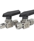 Front view: pair of stainless steel needle valves with black lever handles for high-pressure tubing connections