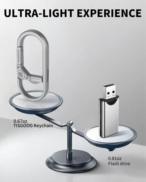 Rugged Titanium Carabiner Keychain Clip With Quick Release Minimalist EDC Key Hook And Bottle Opener next to a USB drive