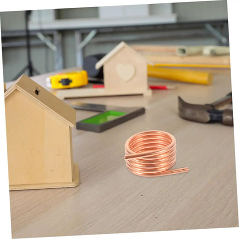 Copper coil for Water Cooling Ring For Brushed RC Yacht Motors Copper Cooling Jacket Kit on workbench with tools