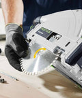 Pro Shop Ready Track Saw Delivering Heavy Duty Performance With 1200 Watt Motor And Hella Precise Negative One To Forty Seven Degree Bevel Cuts Plus Smooth Operation Guide Rail System, close-up of blade installation.