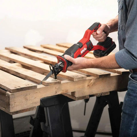 Top Shelf 20 Volt Compact Reciprocating Saw Kit With 2.0 Ah Pwrcore Lithium Battery And Rapid Charger Boss Level Cuts Through Metal PVC Masonry At 3000 Spm Cordless Demolition Power Tool cutting wood pallets.