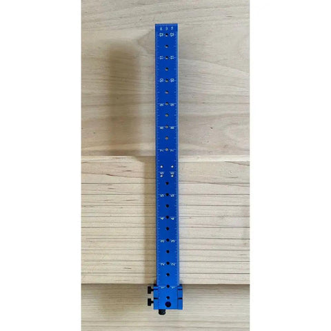 Slick Go To Bandsaw Alignment Gauge With Twelve Inch Laser Etched Sixteenths And Heavy Duty Magnets on a workbench.