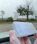 Rock Solid Transponder Mounting Strips For Windshield Toll Tags Heavy Duty Dual Lock Tape shown holding on glass.