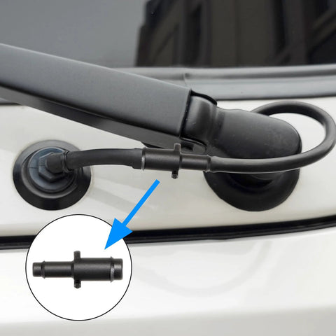 Inline vacuum hose connector, black nylon, installed on a car hose.