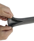 Hands compressing Pipe Insulation Tubing 1 Inch By 3 Eighth Inch Heat Preservation Insulated 6 Foot Length Two Handle Grips All Black Great For Hot Or Cold Pipes Reduces Noise And Energy Loss While Softening And Protecting Pipes