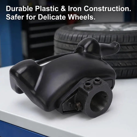 Duck Head Pro Grade Tire Mount And Demount Tool Kit, plastic and iron mount head close-up, black finish, on table