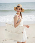 Woman holding Waterproof Beach Tote Bag For Women Dope Ultra Roomy Extra Large Carry On With Wet Compartment, standing on beach