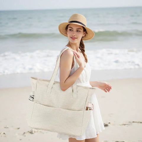 Woman holding Waterproof Beach Tote Bag For Women Dope Ultra Roomy Extra Large Carry On With Wet Compartment, standing on beach