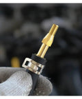 Close-up of 10Pcs 65Mn Steel Spring Hose Clamps Set for Car Fuel Lines showing low profile clamp on hose.