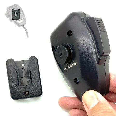 Universal CB Radio Microphone Holder Mount With Adhesive Backing And Pre Drill Holes For Quick No Fuss Install Includes T Tab Clip Belt Clip And Round Knob Compatibility Works With Alinco Anytone Bao Feng Kenwood Midland Motorola Uniden Yaesu shown with hand holding and belt clip view
