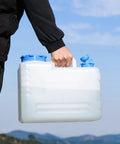 Person carrying 4 Gallon Camping Water Jug With Spigot For Emergency Water Storage Outdoors, Built Tough Food Grade PE Bottle