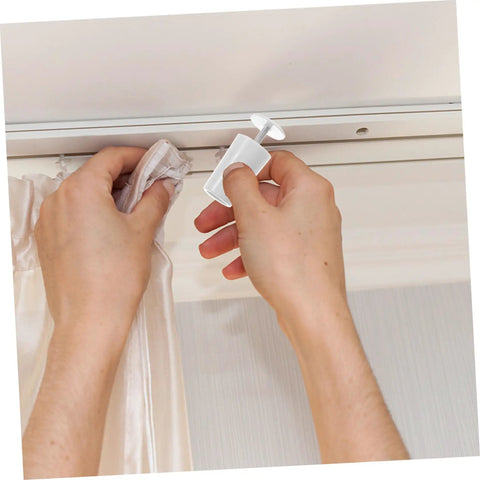 Person using Tough As Nails 8 Pack Vertical Blind Bottom Weights Roller Shutter Stopper Repair Kit for easy installation.