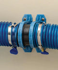 Dust Right Ready-Mount 2.5 Inch Vacuum Hose Fitting Brackets with interlocking teeth and blue ribbed hose installed on wall.