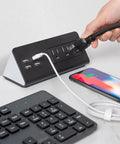 Totally Slick Two Pack Desk Edge Mount Power Strip With Four USB Ports And Three AC Outlets For Home Office Computer Setup featuring a user plugging in a cord.