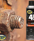 Sidewinder Super Penetrant 14 Oz Aerosol shown next to a rusted bolt, ideal for loosening stubborn rust and grease.