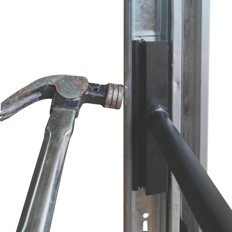 Vertical Track Repair Tool Set for 2 Inch Garage Door Roller Rails Pro Grade Repair Kit in use on a door track with a hammer