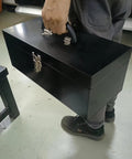 Person holding Portable 16 Inch Metal Toolbox With Heavy Duty 18 Gauge Steel Construction Black Large Tool Box Drawer Organizer