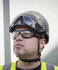 Worker wearing Pro Full-Frame Safety Glasses With Removable Gasket, ANSI Z87.1 Plus, clear lenses, UV protection, helmet