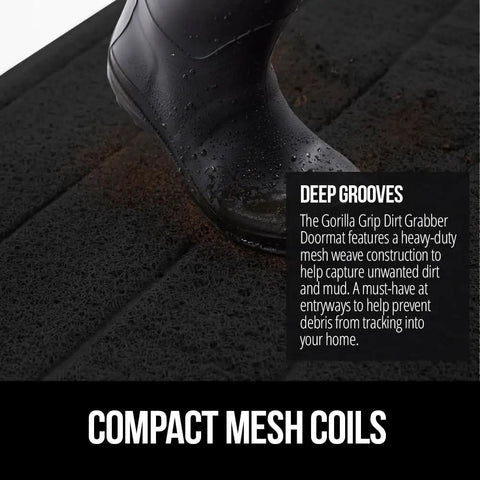 Mesh Weave Dirt Grabbing Doormat For Indoor Outdoor Use With Low Profile Entry Mat 35x23 Heavy Duty Black Welcome Mat That Captures Mud Dirt And Messes In High Traffic Areas with a boot stepping on it, showing mesh texture.