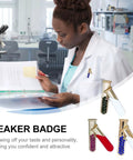 Woman in lab coat wearing 4 Piece Chemistry Beaker Brooch Set With Flask Design, Metal Alloy Scientist Lapel Pins For Lab Coats.