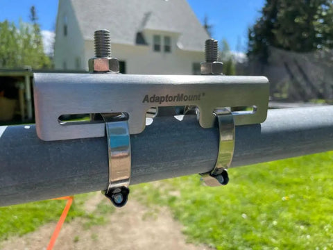 Junction Box Pipe Mount Bracket With Adjustable Clamps installed on a metal pole, showcasing outdoor stainless steel construction.