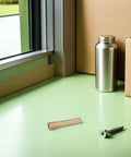 Top Notch 2.4 Mm Tig Welding Cup With Glass Liner For Wp17 And Wp18 Nozzles on green surface near metal can and screw.