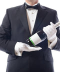 Person in tuxedo holding a wine bottle wearing White Cotton Gloves 10 Pairs Large Size Handy For Art Handling Crafting Jewelry And Silver Inspection Washable Reusable Archival Gloves For Cleaning And Display Perfect For Coin Grading And Delicate Tasks.