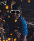 Built Tough Job Site Welding Goggles Featuring Universal Fit Dustproof Antisplatter Black Gray Lenses worn by a worker amid flying sparks.
