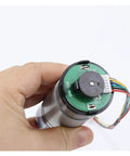 Hand holding Beefy 36mm DC Gear Motor With Planetary Gearbox And Encoder 12V 24V Dual Voltage Speed Adjustable CW CCW