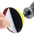 100 Pack 2 Inch Sanding Discs Kit With Polishing Pad Plate held near a drill