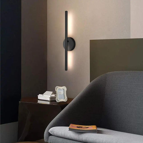 Black Wall Sconce Rotatable 360 Degree LED Light Fixture For Bedroom, Living Room, And Hallway on dark wall with couch