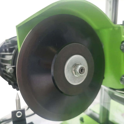 Close-up of Slick CNC Circular Saw Blade Sharpener With Smart Touchscreen, featuring a grinding wheel for precise blade sharpening.