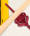 Rigid Aluminum Miter Gauge For Table Saws With Telescoping Fence positioned next to wood, showcasing ergonomic grip and adjusting rail design.