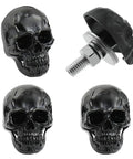 Badass Skull License Plate Screws And Motorcycle Plate Bolts Featuring Four Piece Black Fastener Set showing four black skull bolts and one fastener.