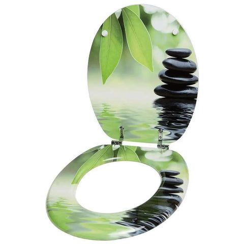 Prime Soft Close Toilet Seat With Adjustable Quick Release Hinges And Dead Quiet Slow Shut Action For A Durable Resin Bathroom Setup, decorated with green leaves and stones.