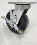 Bad Ass Heavy Duty Six Inch Swivel Caster With Kingpinless Phenolic Wheels Plus Top Lock Brake Built Tough For Your Shop Gear Rolling 1200 Pounds Without Skipping A Beat, showing the caster with a top lock brake.