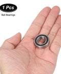 Ceramic hybrid ball bearing, 15x26x7 mm (Si3N4), double-sealed, held in hand.