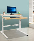 Heavy Duty Dual Tier Standing Desk With Smooth Crank Lift Tough Locking Wheels And Roomy Carbon Steel Desktop For Home Office side view in modern workspace.