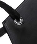 Close-up of grommet and strap on Pro Grade Heavy Duty Vinyl Apron Big Ol Extra Large 43 By 29 Inch Chest To Knee Coverage Waterproof Oil Resistant