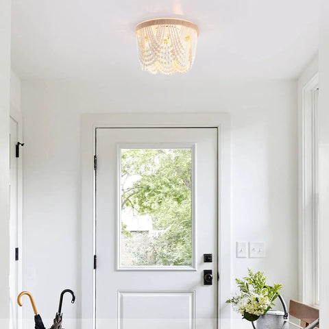 Boho Bohemia Wood Beaded Flush Mount Ceiling Light Three Light Fixture With White Finish in bright entryway