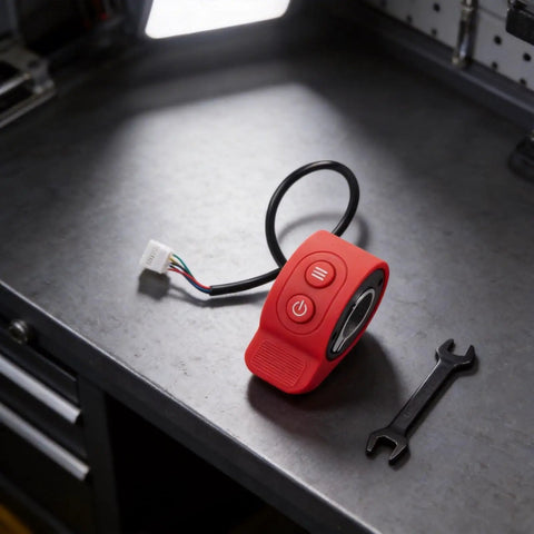 Electric Scooter Thumb Throttle Switch For 5 Wire Controllers in red on a workbench with wrench, durable ABS material.