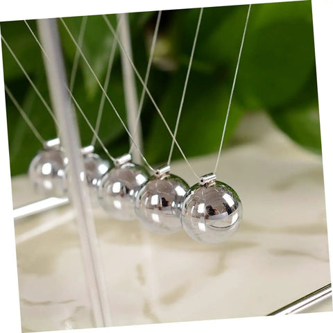 Close-up of Newton Pendulum Desk Toy For Home Office Decor Square Iron Balance Gadget That Makes Physics Fun Hands On Learning Tool